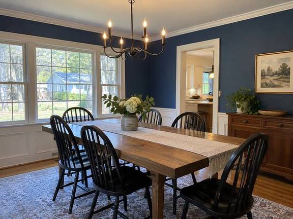 Deep blue dining room with refined trim — Connecticut residential design inspiration