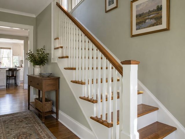 Freshly painted stair hall and balustrade — Connecticut residential design inspiration