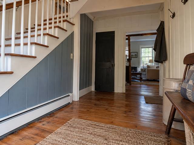Painted wall paneling in an entry hall — Connecticut residential design inspiration