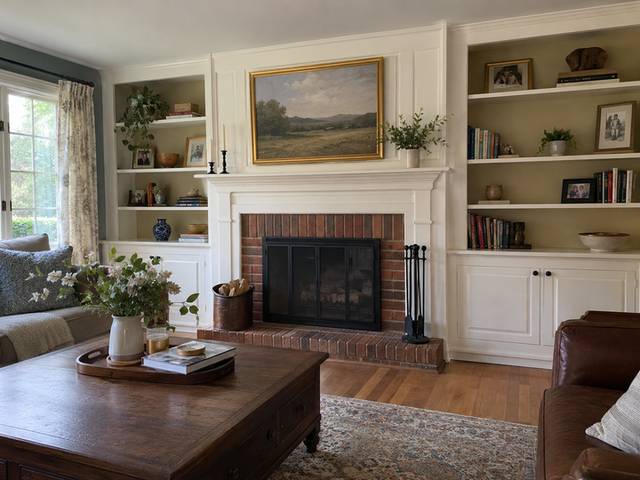 Built-in bookcases beside a living room fireplace — Connecticut residential design inspiration