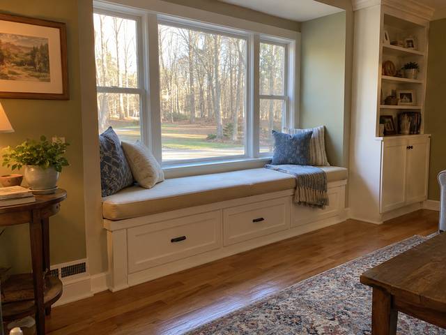 Window seat with fitted storage below — Connecticut residential design inspiration