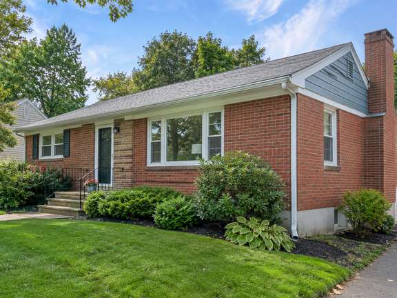 Refreshed home siding with white trim — Connecticut residential design inspiration