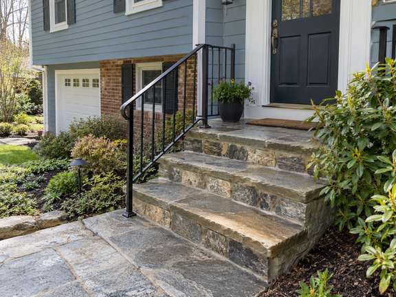 Stone entry steps with a clean natural finish — Connecticut residential design inspiration